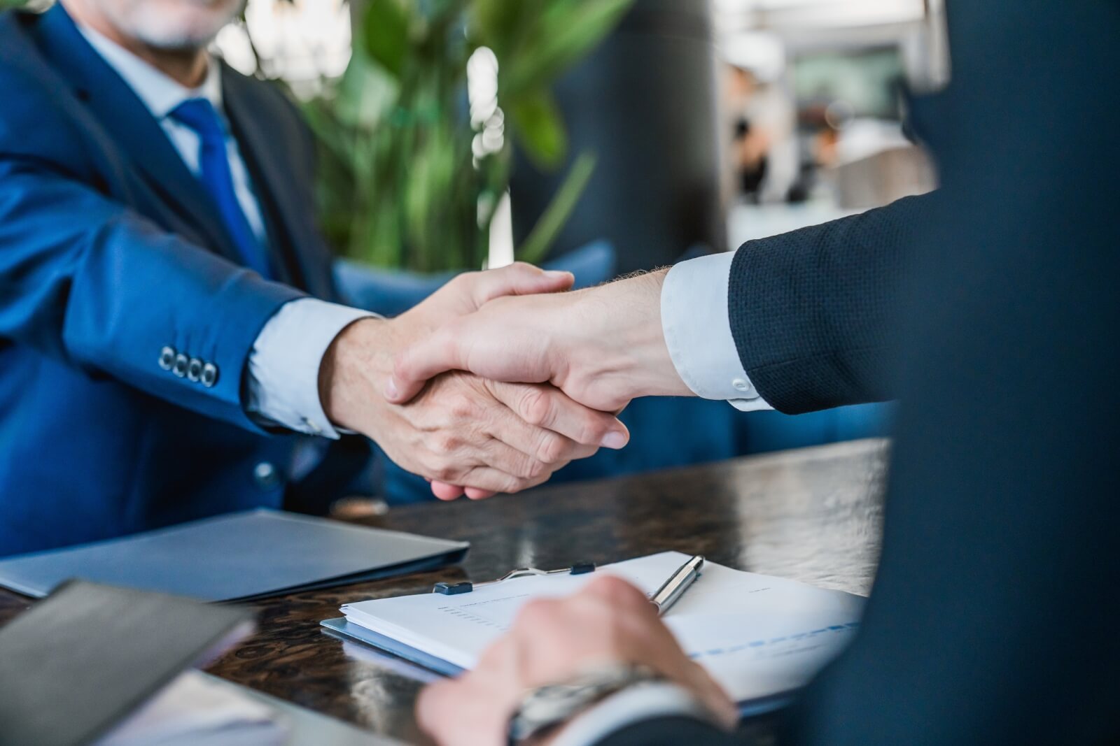 close-shot-businessmen-making-handshake-partner-step-3